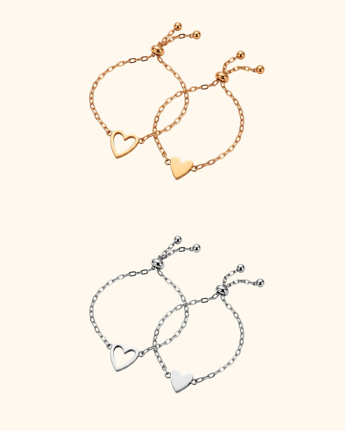 The same mother-daughter heart bracelet set in gold and in silver: an open heart for mom, a filled heart for her daughter