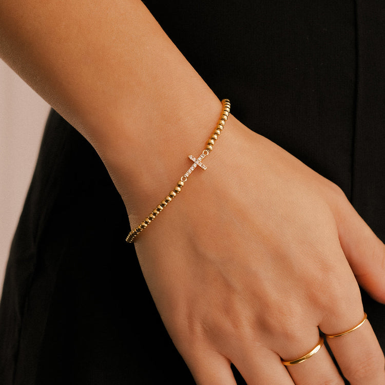 20-GoldBeadedCrossStretchBraceletmodel.jpg